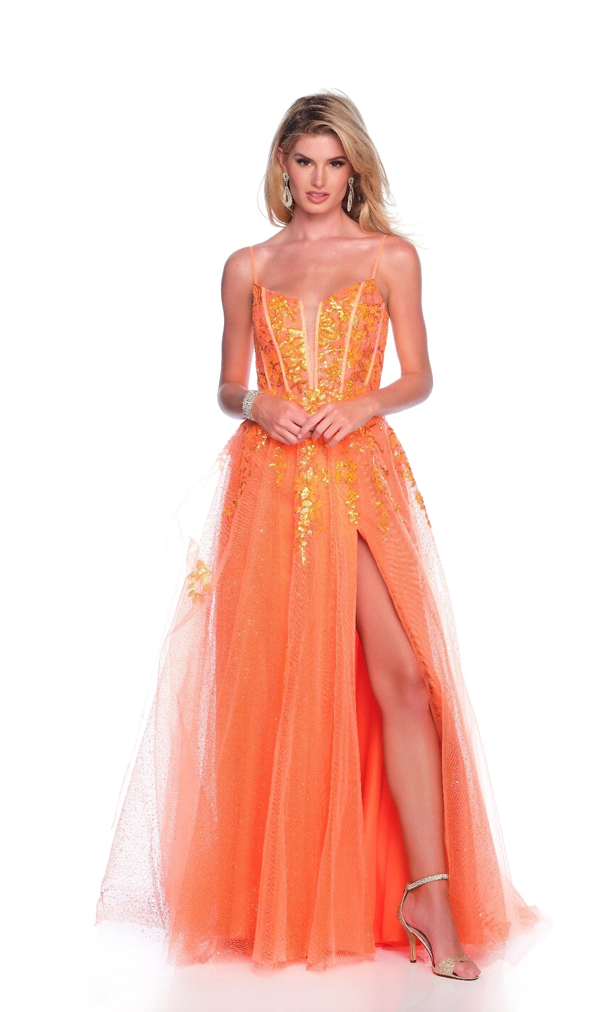 A person wears the Dave and Johnny 12008 long orange prom dress, featuring floral details, a corset bodice, and a high slit, standing against a white background.
